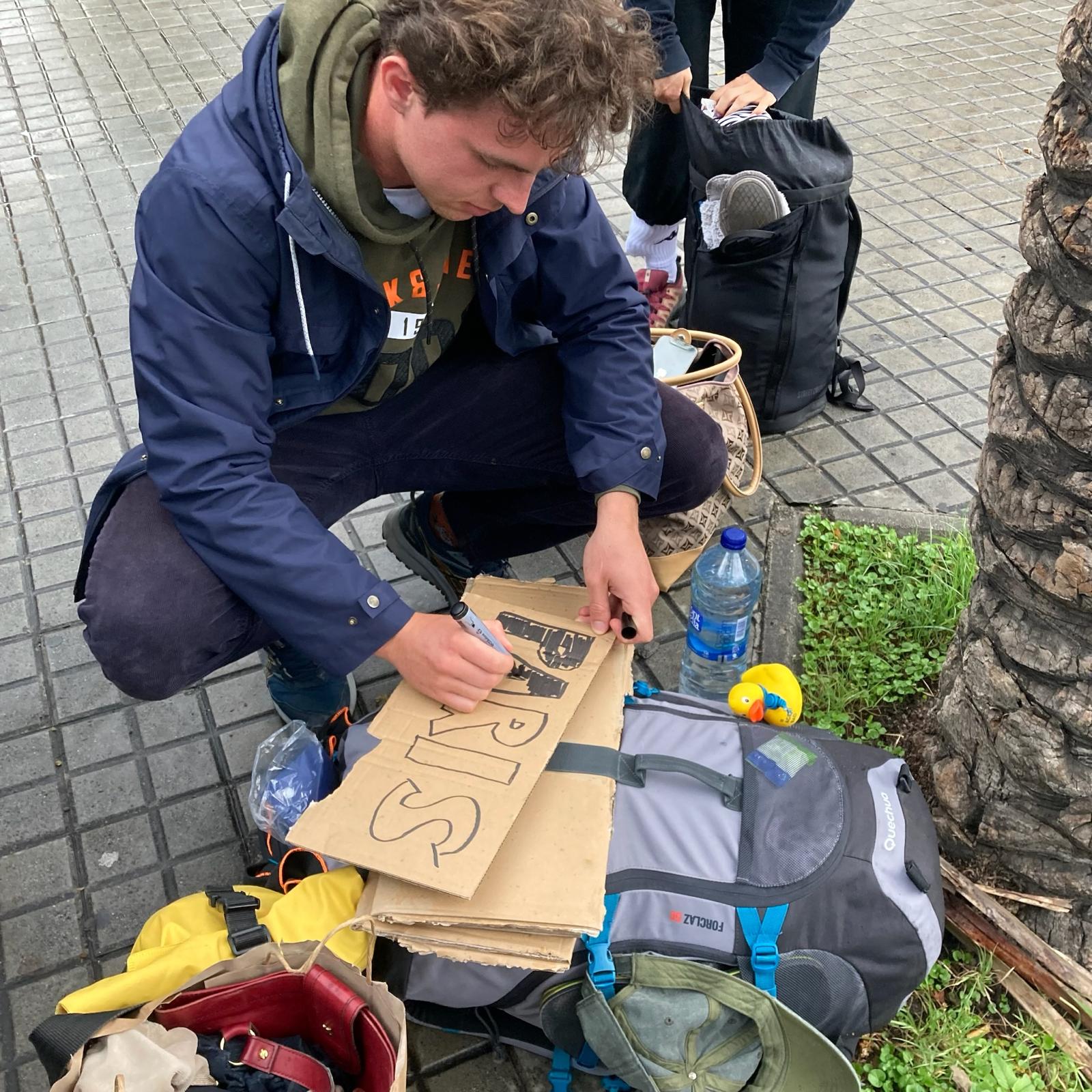 Me writing a sign for Paris